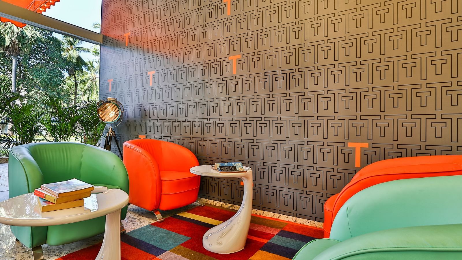 Sofa chair seating with coffee tables placed on a colourful carpet