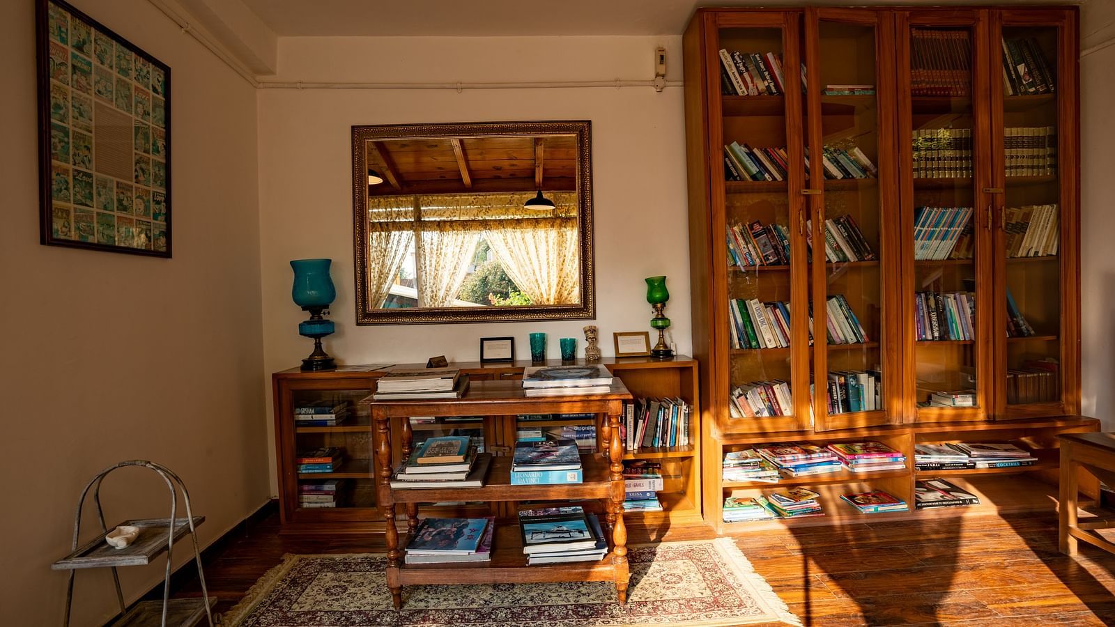 A space with a huge cupboard filled with books at Te Aroha By Shervani, Mukteshwar