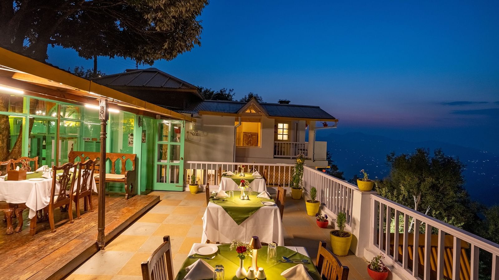 An open space dinning area with a great side view at Te Aroha By Shervani, Mukteshwar