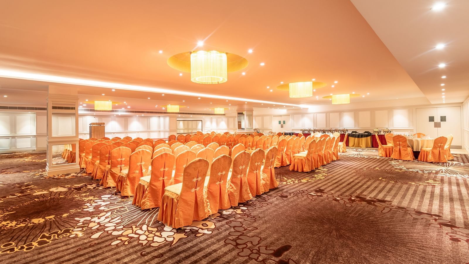 Brightly lit banquet hall with chairs arranged in rows for a formal seminar or presentation- TGI Grand Fortuna, Krishnagiri Main Road, Hosur