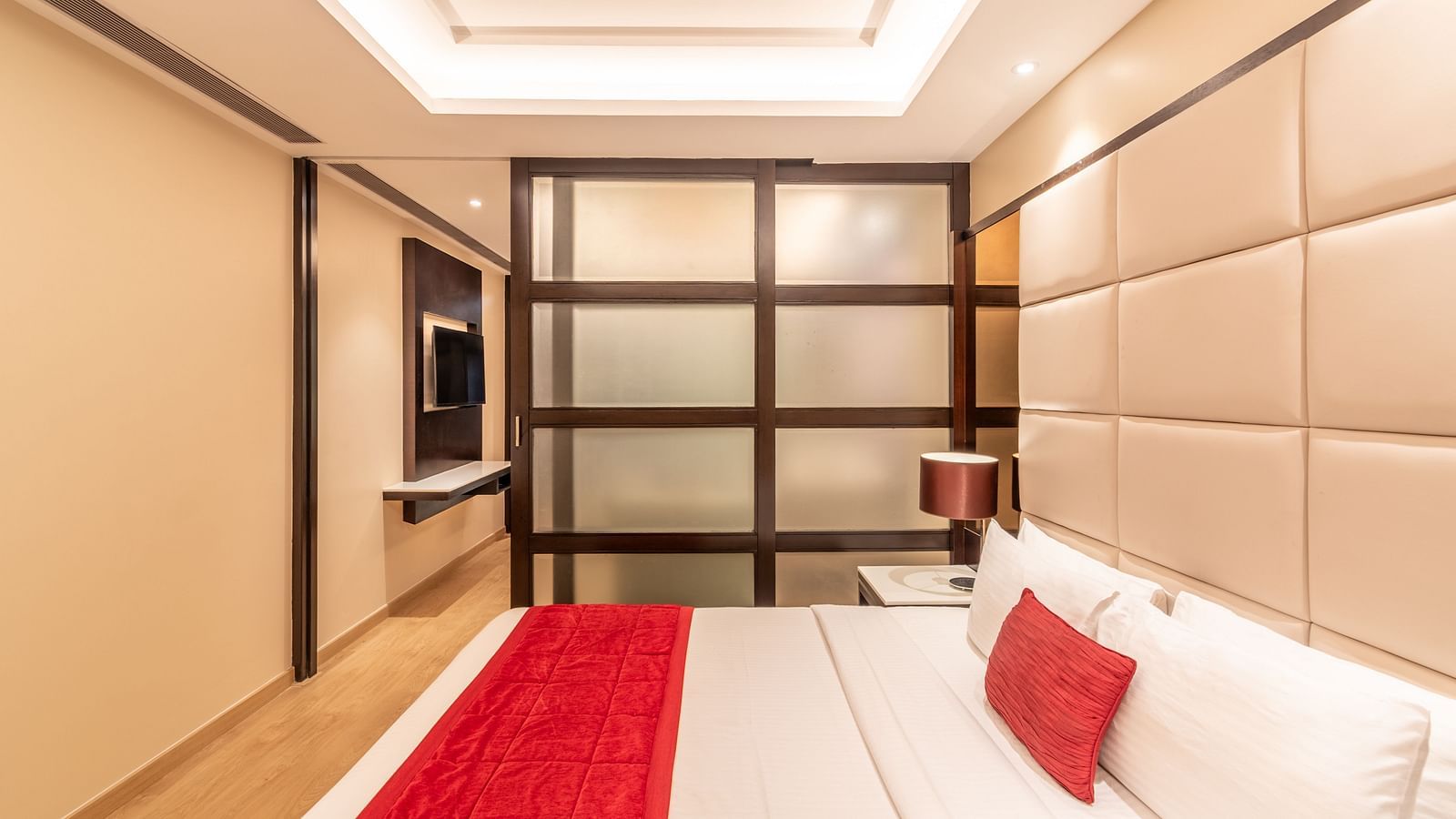 Elegant bedroom of fortuna suite with large bed and stylish decor- TGI Grand Fortuna, Krishnagiri Main Road, Hosur