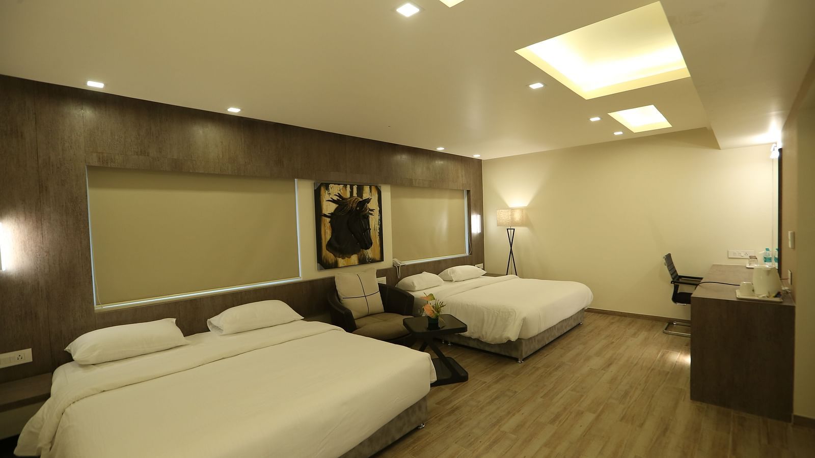 Club Suite featuring multiple beds and a desk area.
