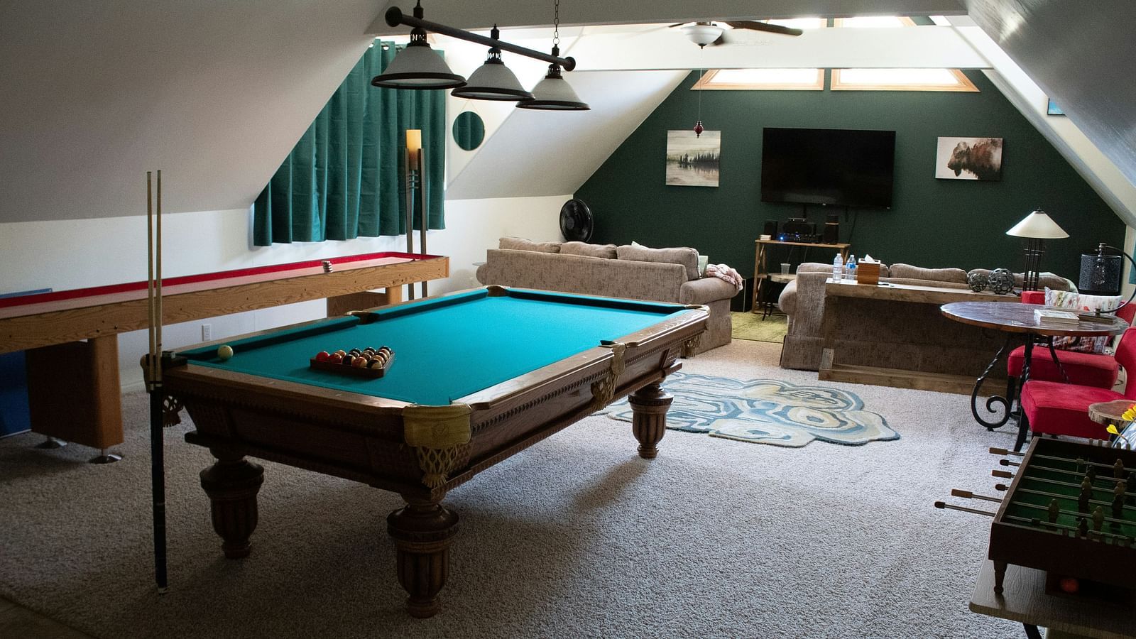 A pool table int he middle of the room with a tv wall mounted in the background - The Cindrella Hotel, Siliguri