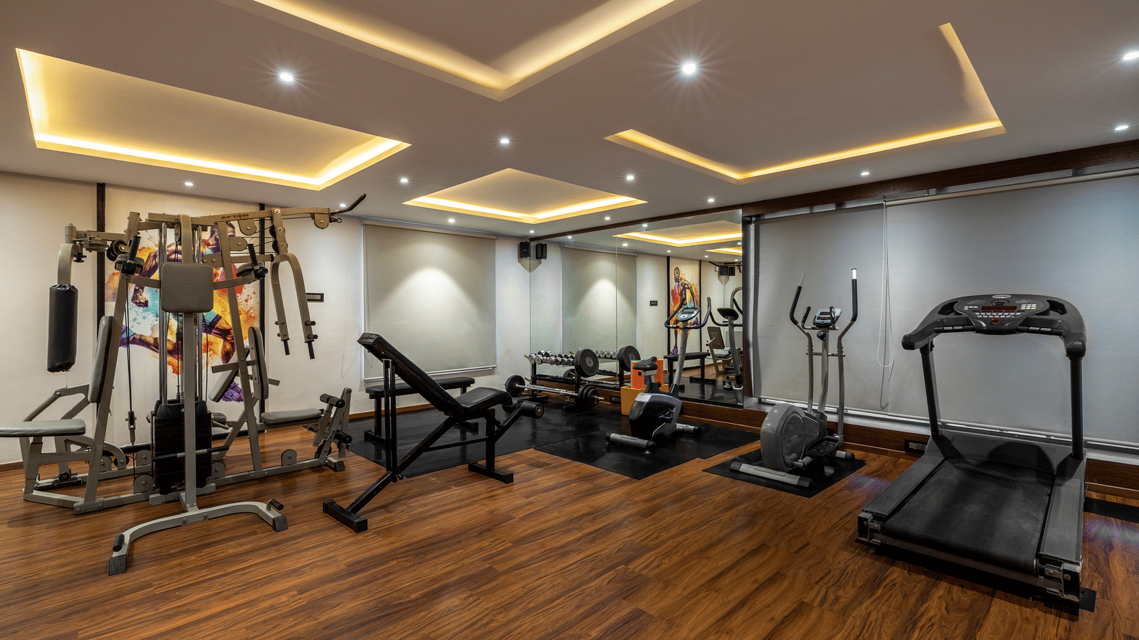  A fitness center at the Citrine Hotel with a treadmill, weights, and other exercise equipment.