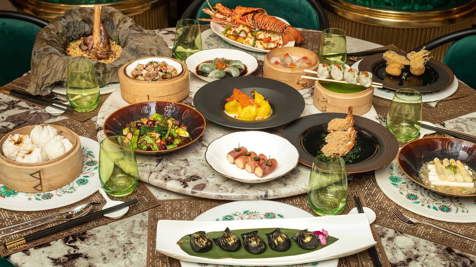 A wide array of dishes on a table at The Claridges New Delhi