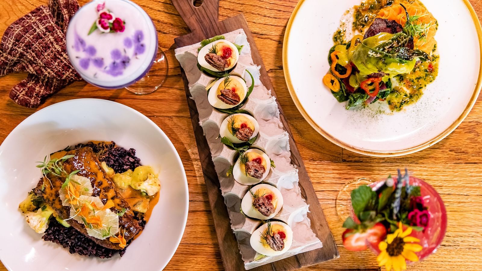 A table is neatly arranged with variety of dishes.- The Grand Hotel & Ballroom, McKinney