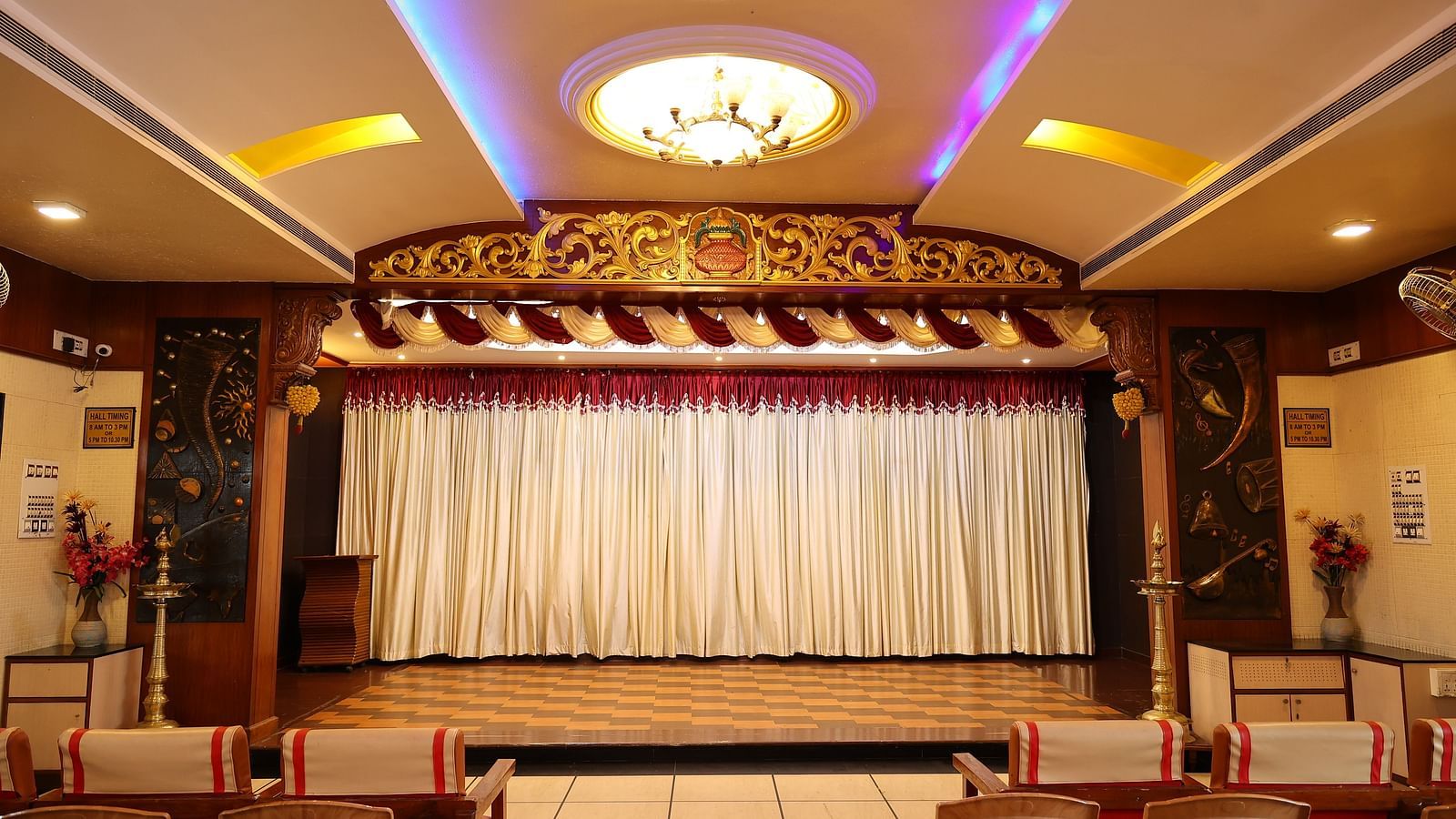 image of the banquet hall at The Grand Krishna Rooms featuring a grand stage in front of the hall