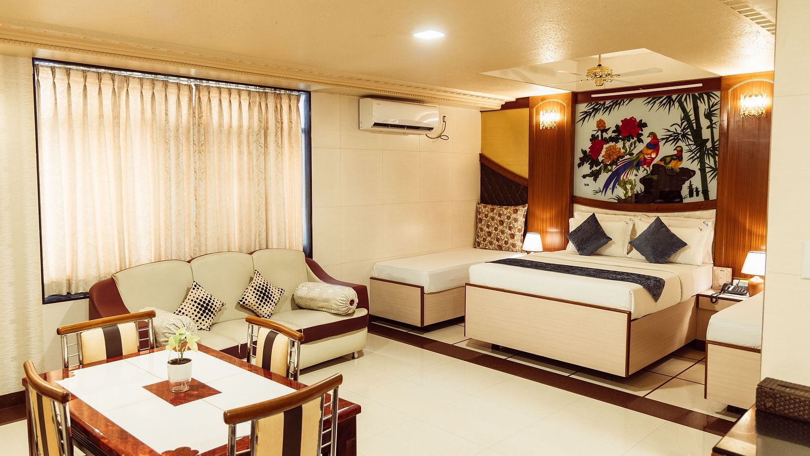 image of the grand suite featuring a luxurious bedroom with modern interiors and plenty of space at The Grand Krishna Rooms, Bengaluru