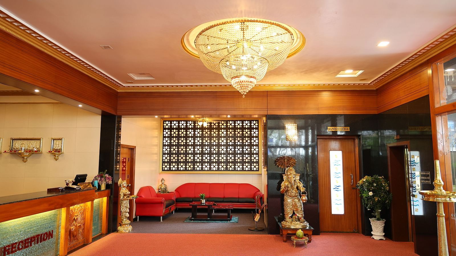 image of the lobby at The Grand Krishna Rooms with a beautiful chandelier hanging from the ceiling