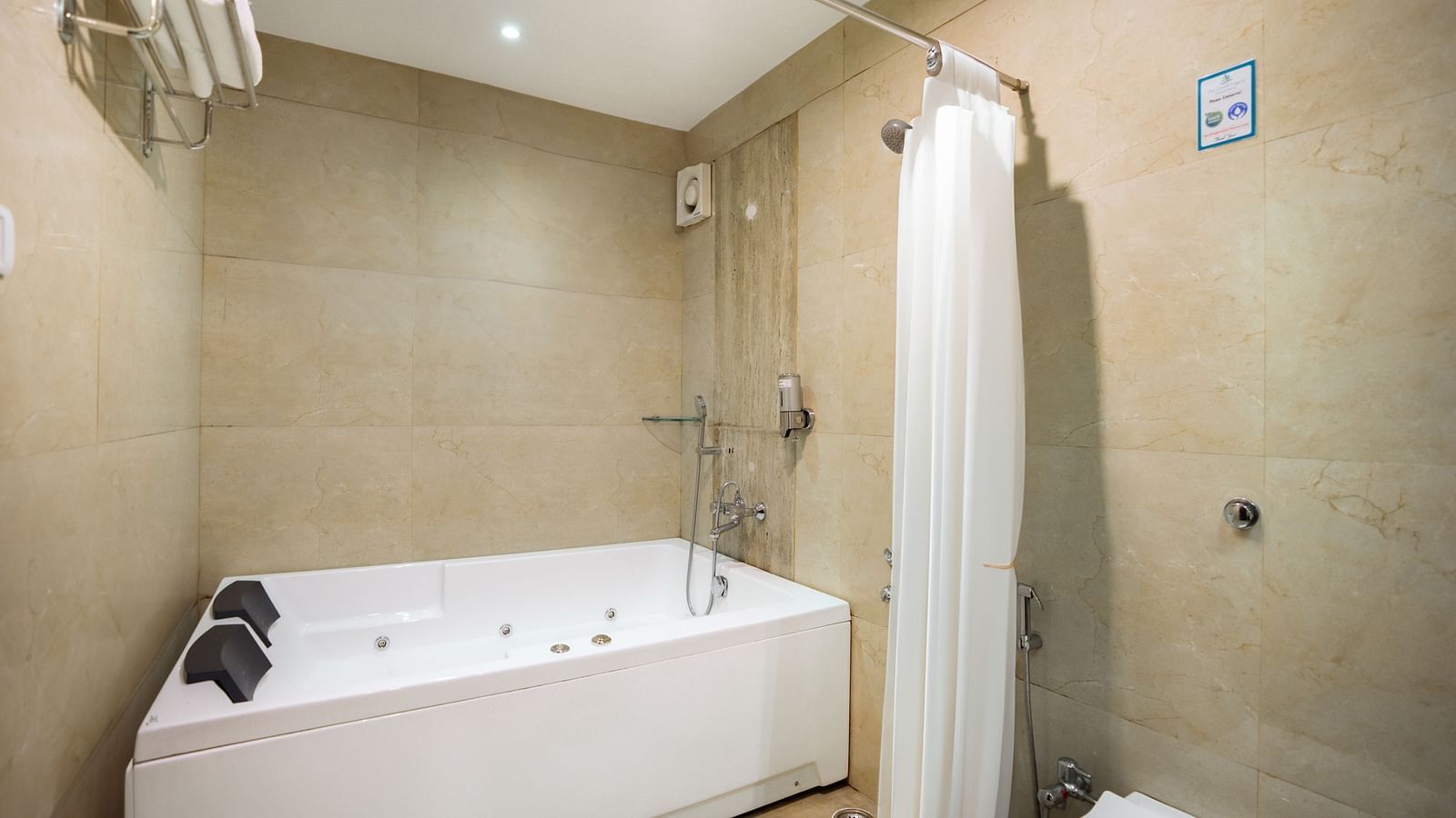 Image of a bathtub in a well equipped washroom of the resort | The Grand Legacy Resort and Spa