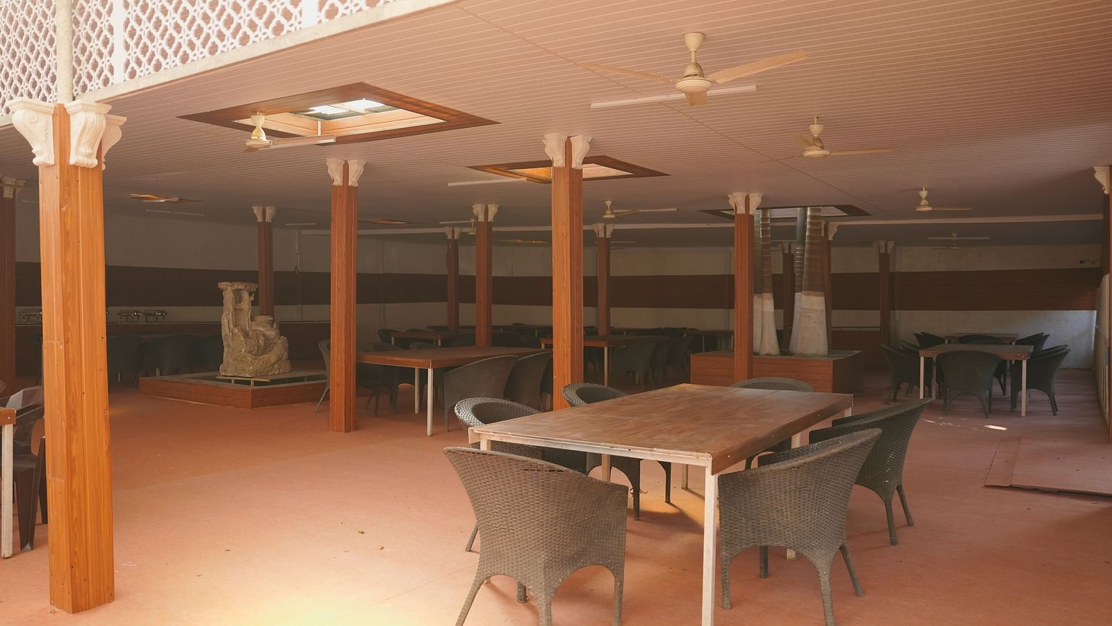 A dining seating area at The Meenakshi Resort by Welcome Inn Hospitality, Bangalore.