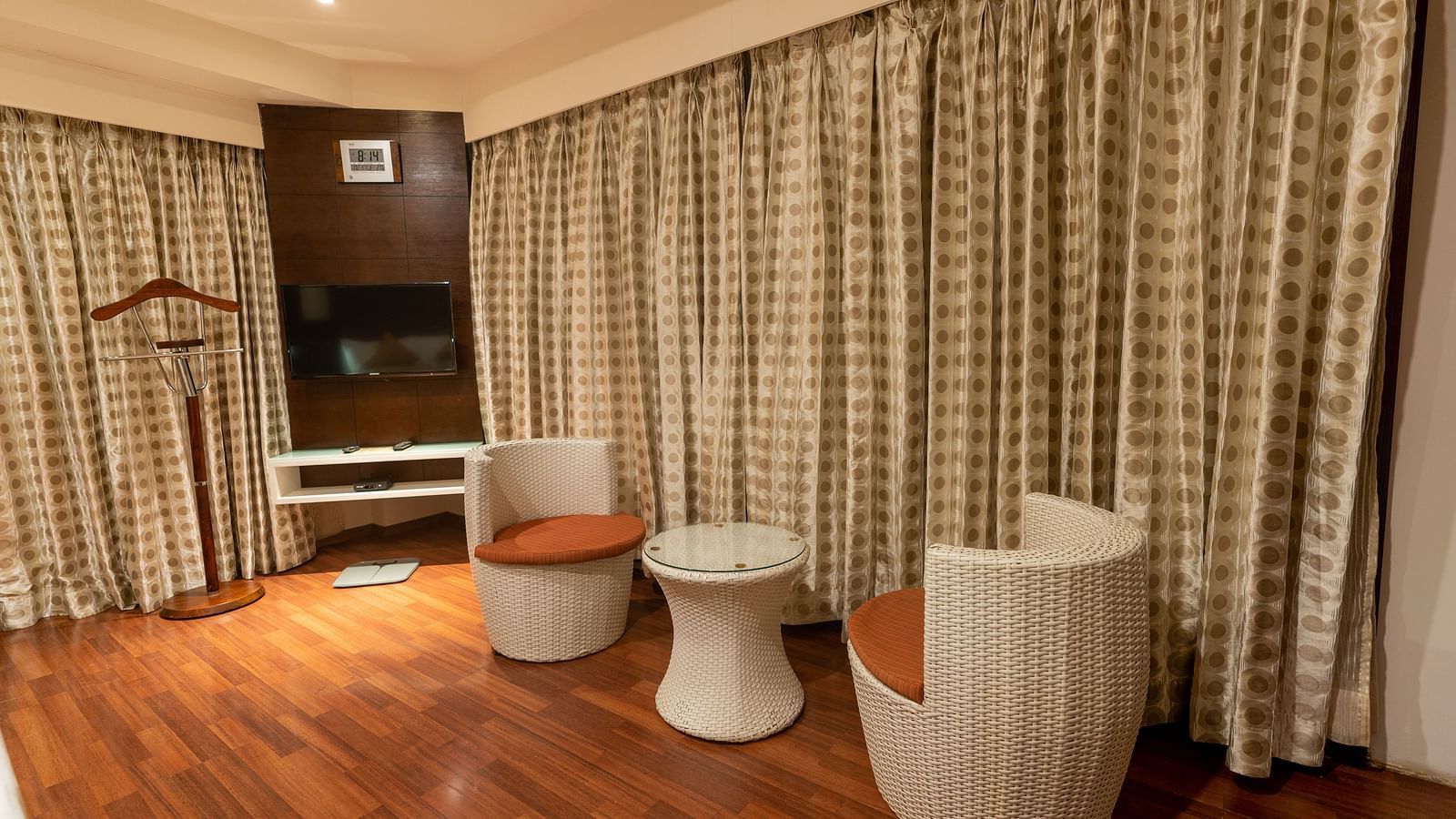 Club Suite rooms in Hubli with chairs and a round table at The President Hotel, Hubli