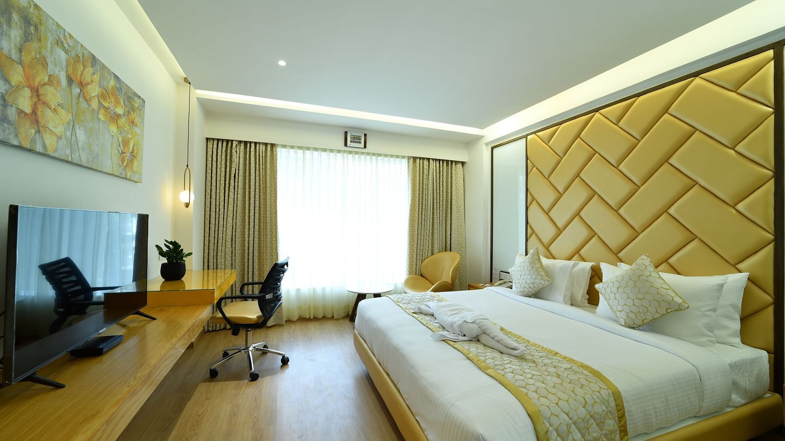 Hotel room with contemporary design featuring a workstation and a relaxing ambiance - The President Hotel, Kumara Park, Bangalore