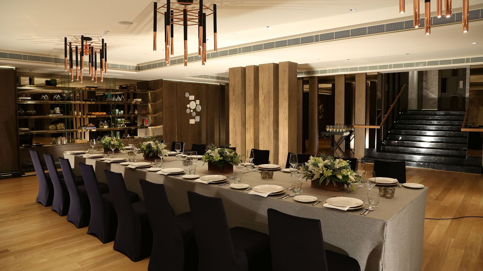 A sophisticated dining space with modern decor, offering a premium experience at The Raintree, St. Mary's Road.