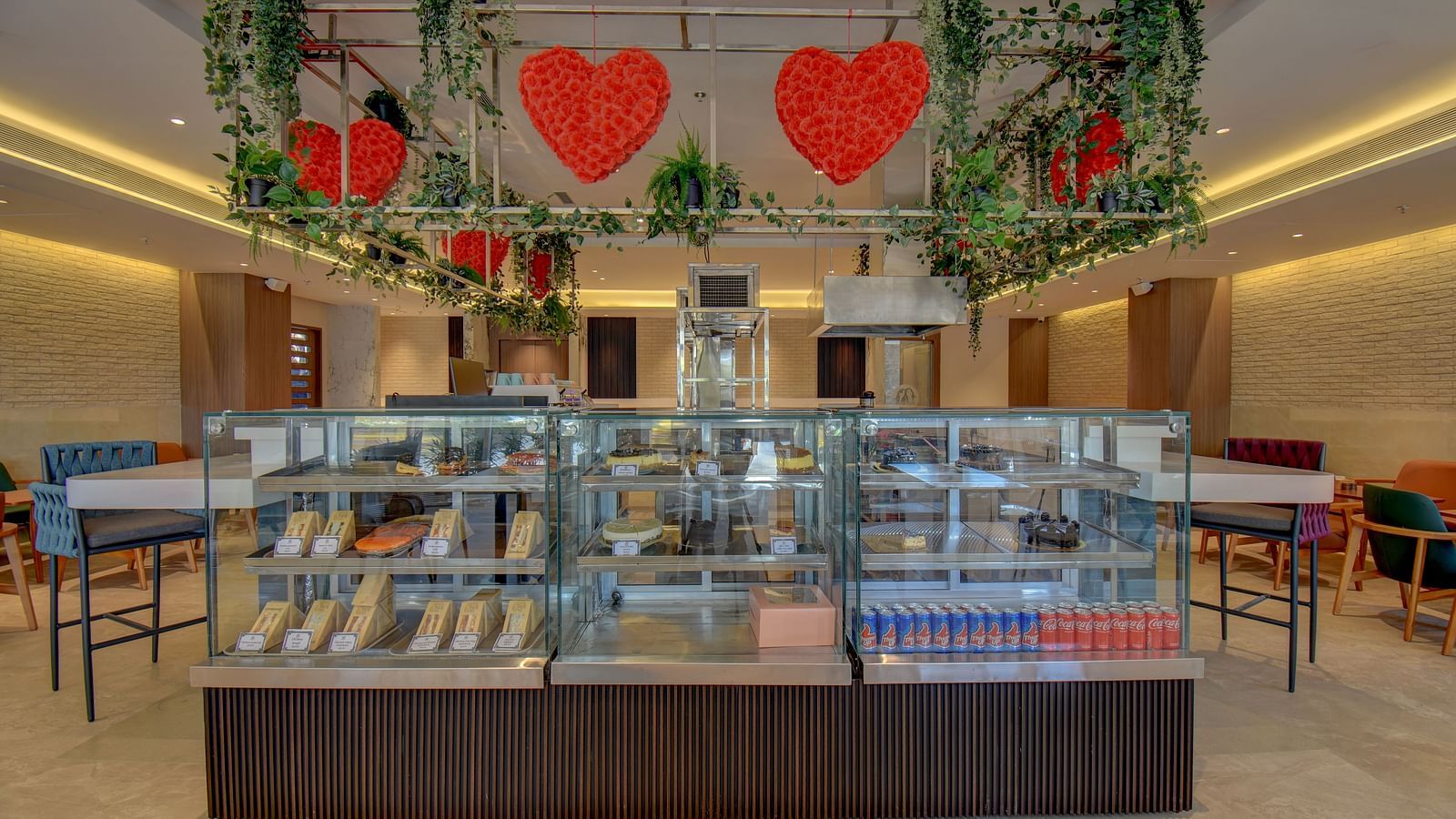 Over view of two sister's cafe The SSK Solitaire Boutique Hotel & Spa, Gangapur Road - Nashik featuring baked goods and chairs.