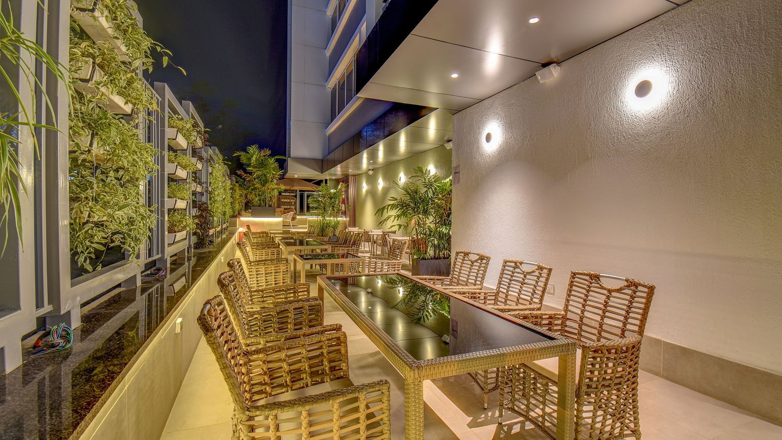 Seating area of a restaurant with table and chairs on a terrace | The SSK Solitaire Boutique Hotel & Spa, Gangapur Road - Nashik