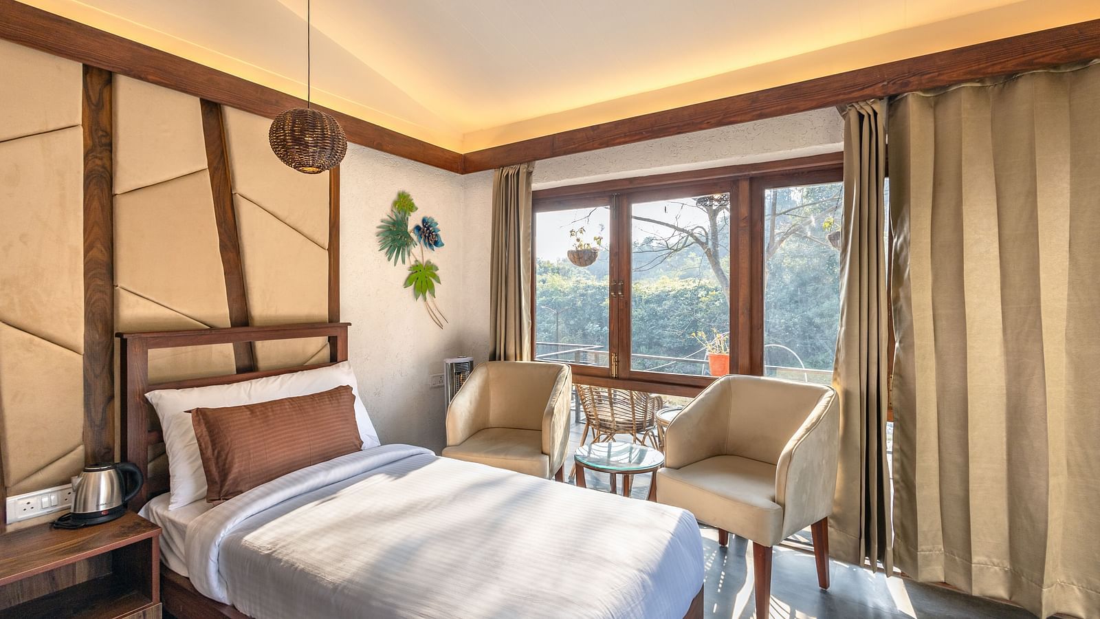 A small placed next to the chairs of River View Room at the Sylvan Retreat, Dehradun.