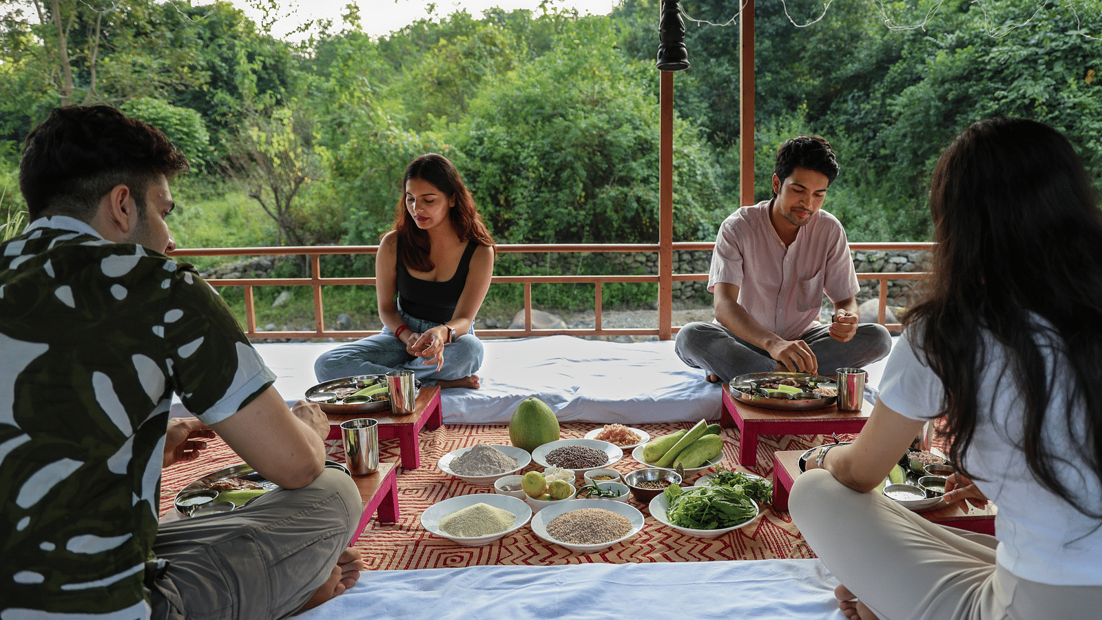 A couple eating a pahadi meal at The Sylvan Retreat, Dehradun.