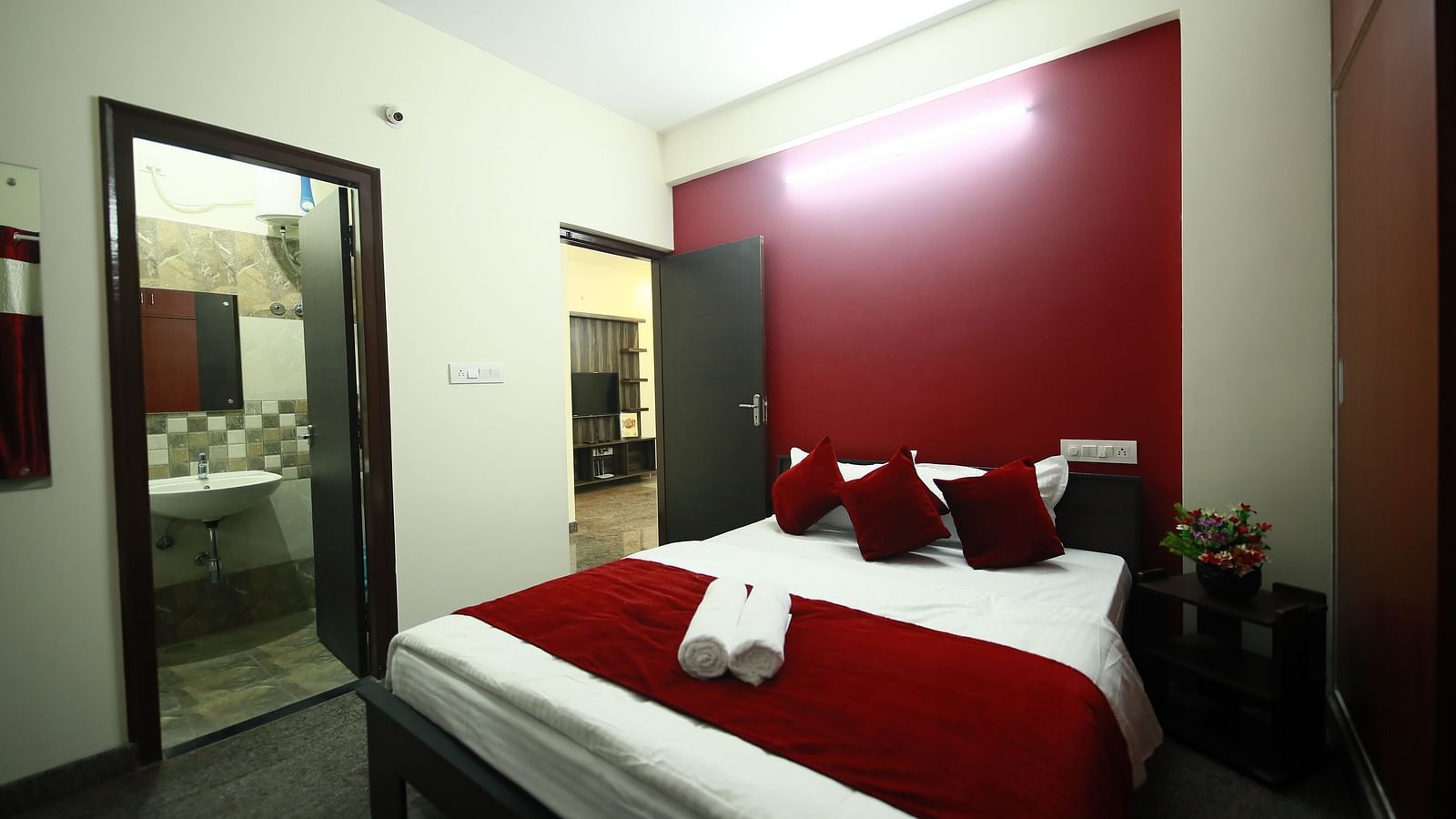 A queen size bed in a room at Tranquil ABS Orchid Serviced Apartments