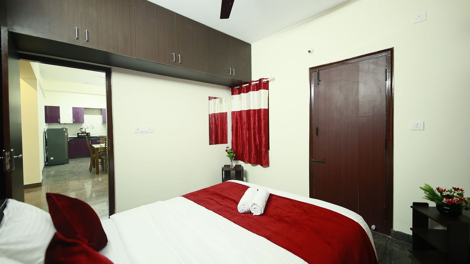 A queen size bed in a room at Tranquil ABS Orchid Serviced Apartments