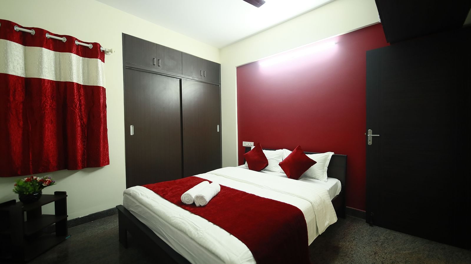 A queen size bed in a room at Tranquil ABS Orchid Serviced Apartments