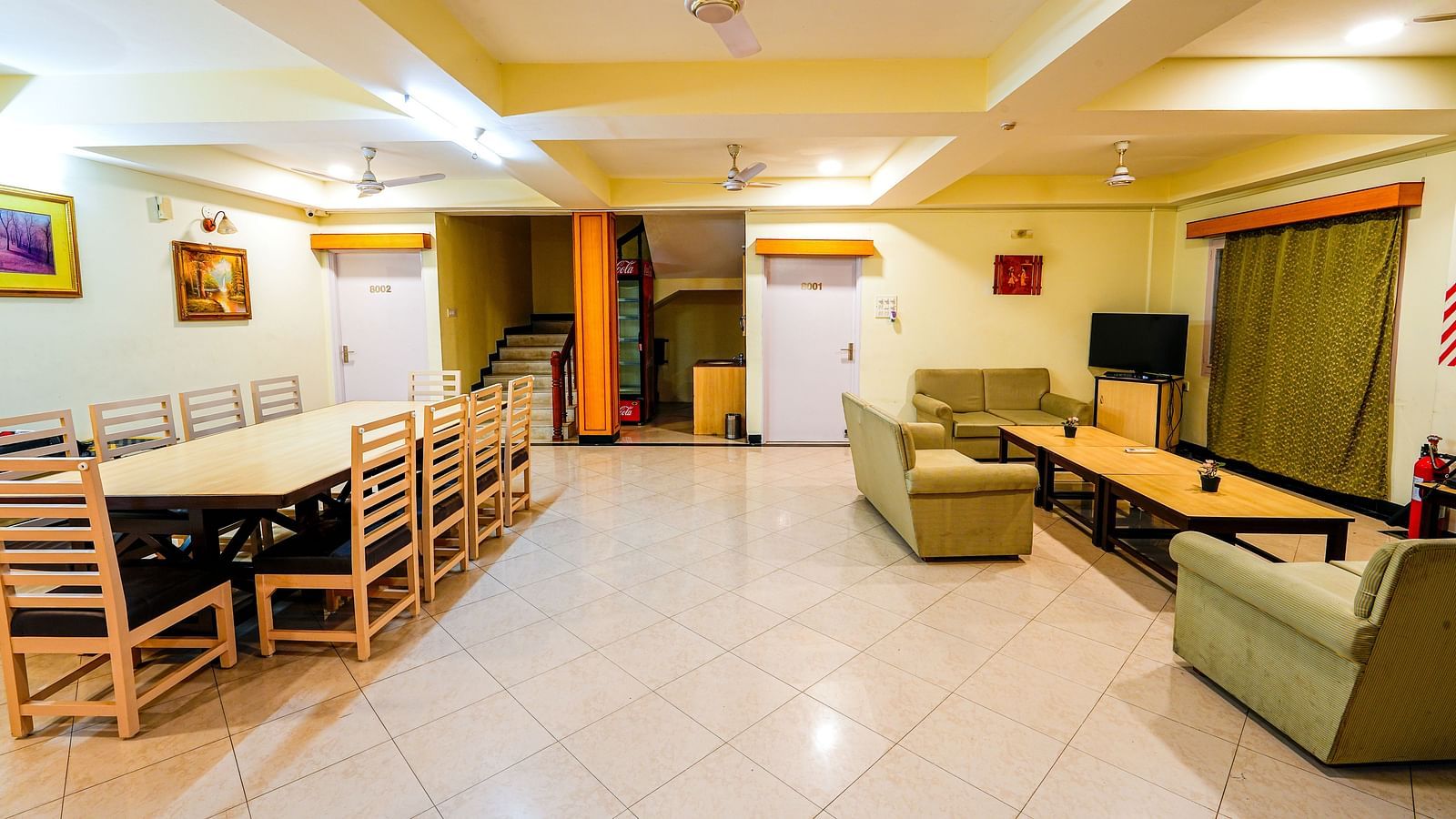 Room at Vasundhara Villa with sofa seating, a coffee table and a dining table