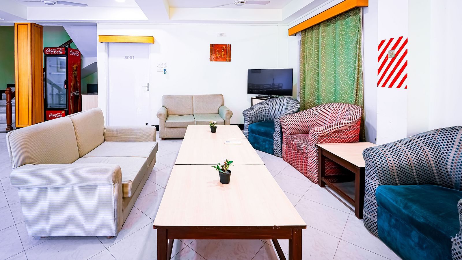 Sofa seating in the living area of Vasundhara Villa