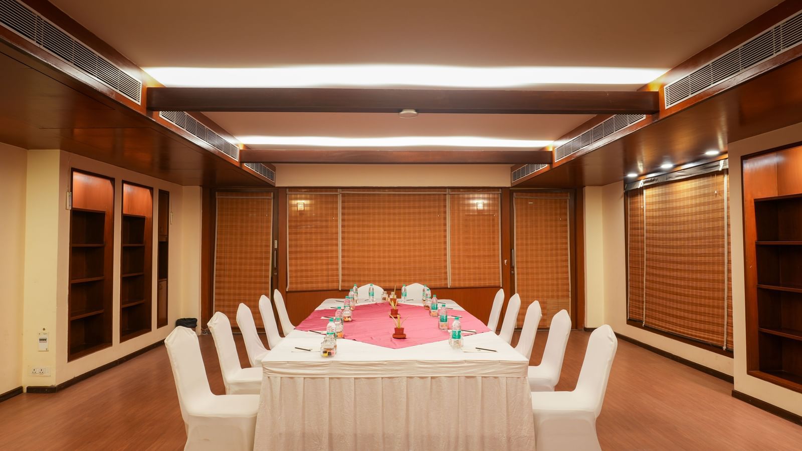 Om three with boardroom-style table setup at Vedic Village Spa Resort.
