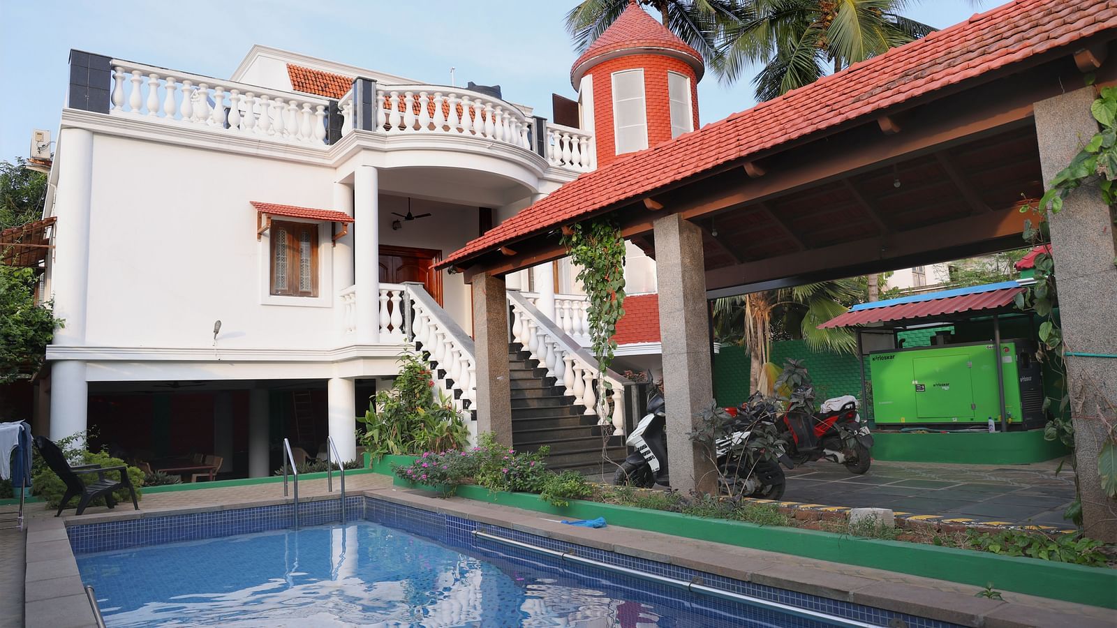Facade of Villa Serenity Le Sejour, Pondicherry with a swimming pool in front.