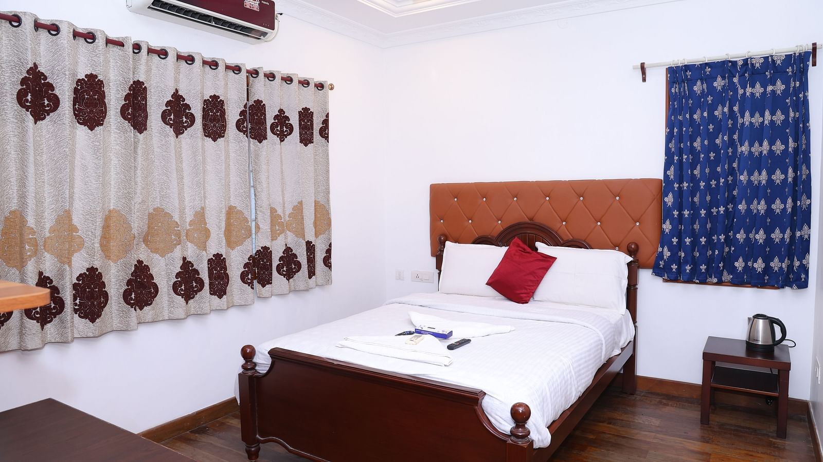 Image of a room with a bed and a window on the side at Villa Serenity Le Sejour, Pondicherry.