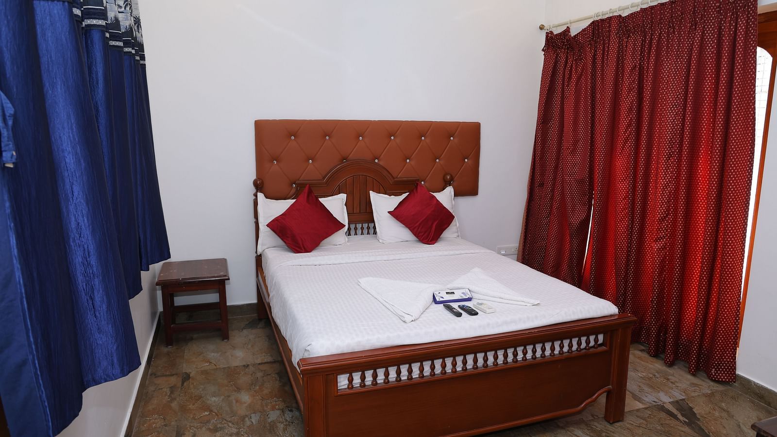 Image of a room with a bed a window on the side at Villa Serenity Le Sejour, Pondicherry.