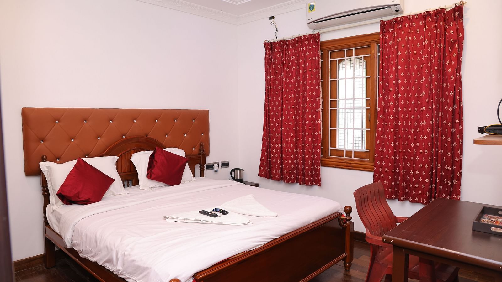 Image of a room with a bed and a window on the side at Villa Serenity Le Sejour, Pondicherry.