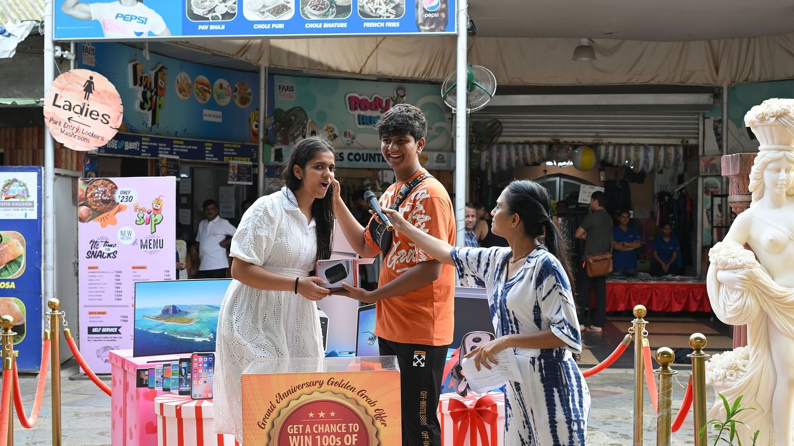 Winners or participants being interviewed on stage during the anniversary event.