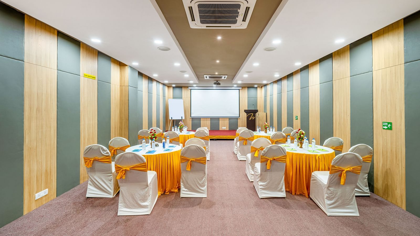 A high-tech conference room with a table and chairs at Westside Hotel Hitech City