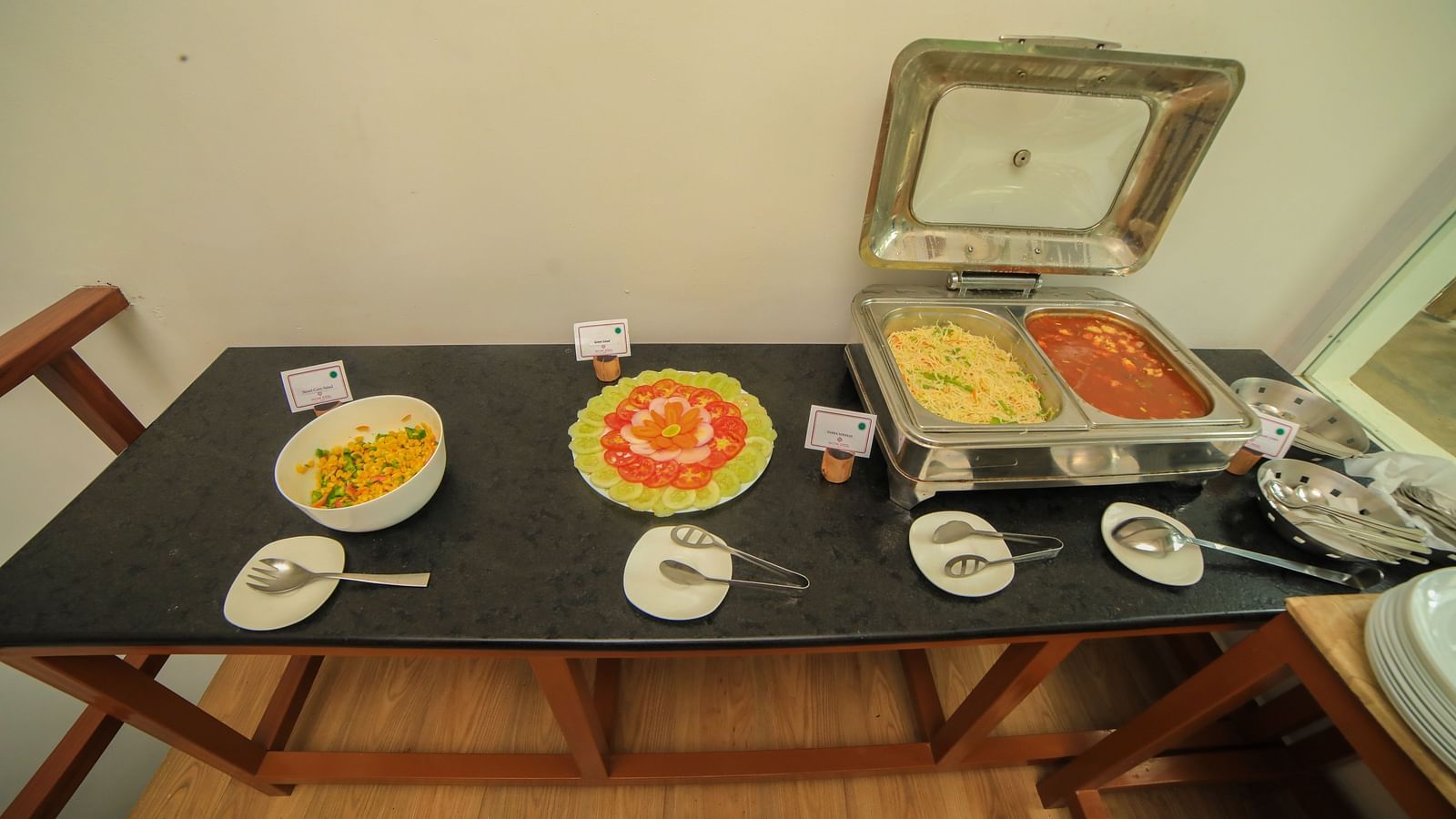 Image of a table with food  and cutleries on it at WOW Bison Woods.