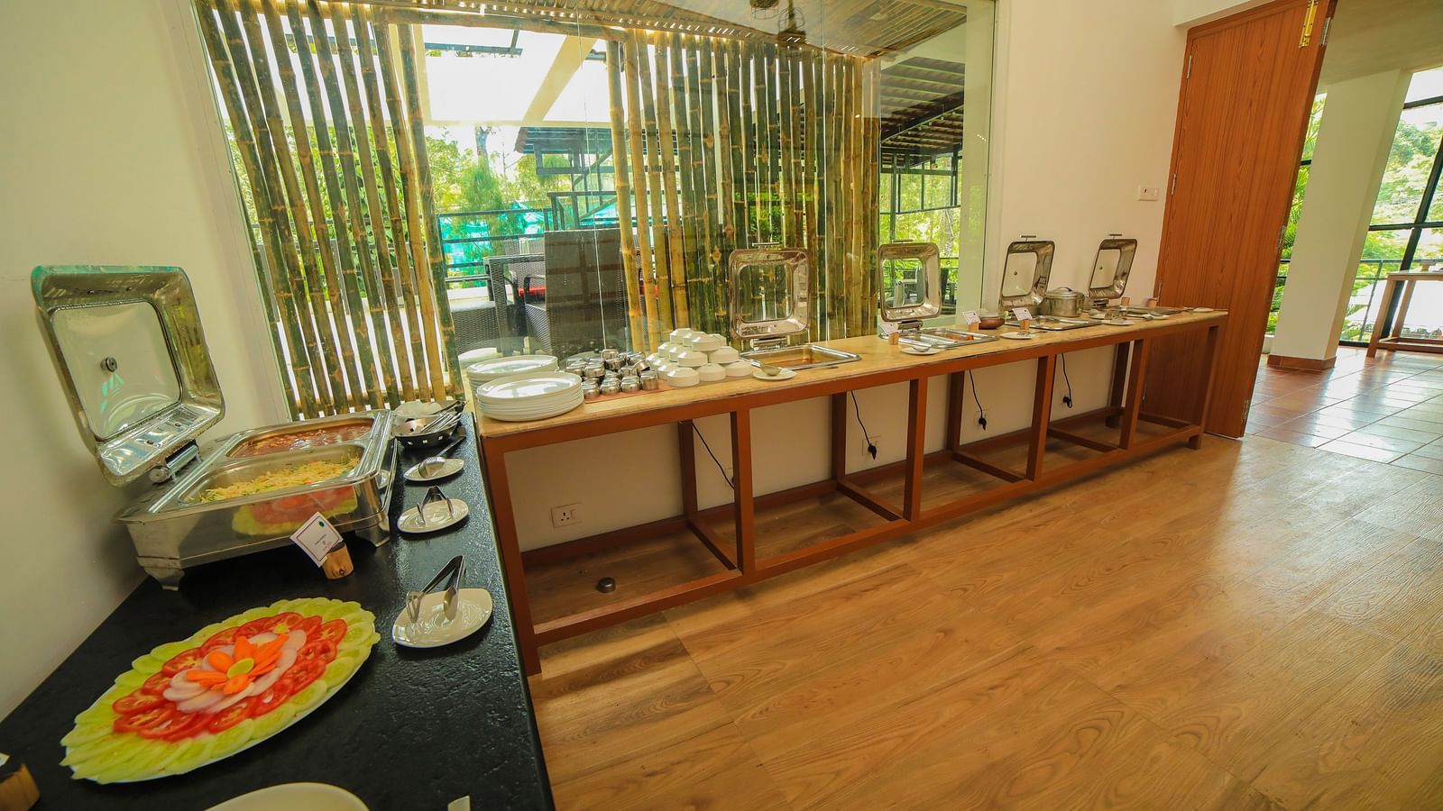 Image of a dining area with a buffet table at WOW Bison Woods.