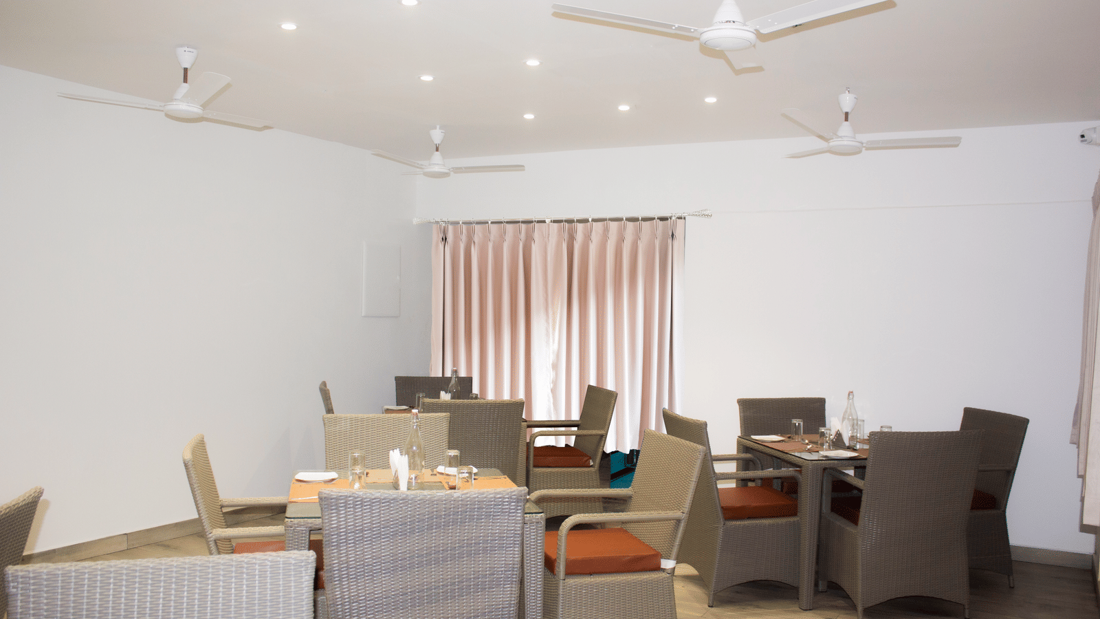 The Spice and Slice Restaurant with dining tables for up to 4 guests at WOW Naturefull Resorts, Yercaud.