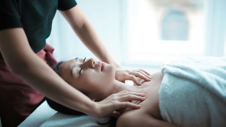 A woman getting a massage at the spa