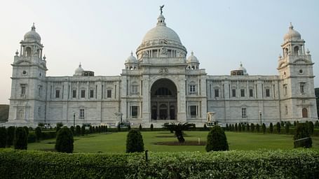 an overview of Victoria Memorial with a manicured garden in front of it