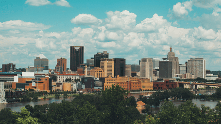 The skyline features numerous tall buildings and skyscrapers