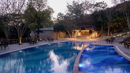 A view of the swimming pool at Essentia Luxury Resort & Spa, Udaipur.