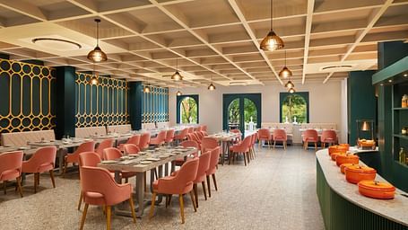 A dining setting of Blue Salt and Coffee at Essentia Luxury Resort & Spa, Udaipur.