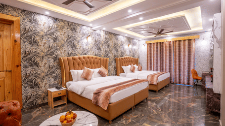 A spacious hotel room featuring twin beds with tufted headboards and dark polished marble floors - Golden Oak By The Lake Hill, Khurpatal