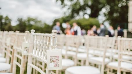 chairs lined in rows in a classroom seating style placed outdoors