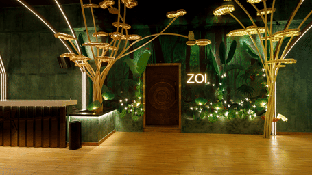 A stylish lounge entrance with green textured walls and decorative golden tree structures - Jenneys Residency, Coimbatore