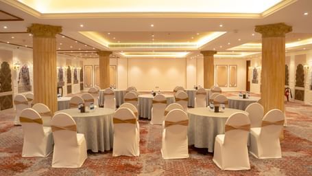 Lavish event space with round tables and grand columns - Kaldan Samudra Palace