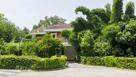 Facade of Wildflower Villa with greenery around - Karma Lakelands.