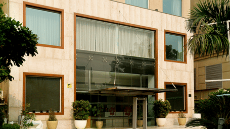 Modern exterior architecture and main entrance of a luxury boutique hotel in Gurgaon.