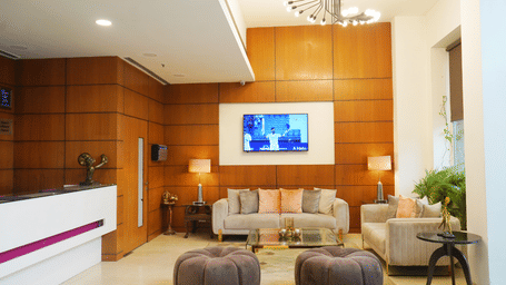 Elegant reception area at Nemesia with a warm colour scheme and comfortable seating for guests.