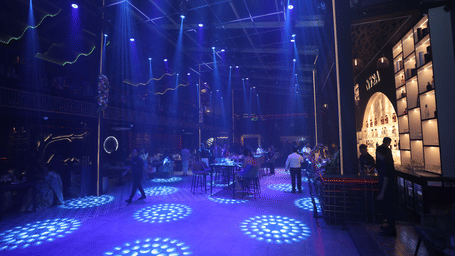 Nysa Skybar, Bengaluru with disco lights and some people moving around.
